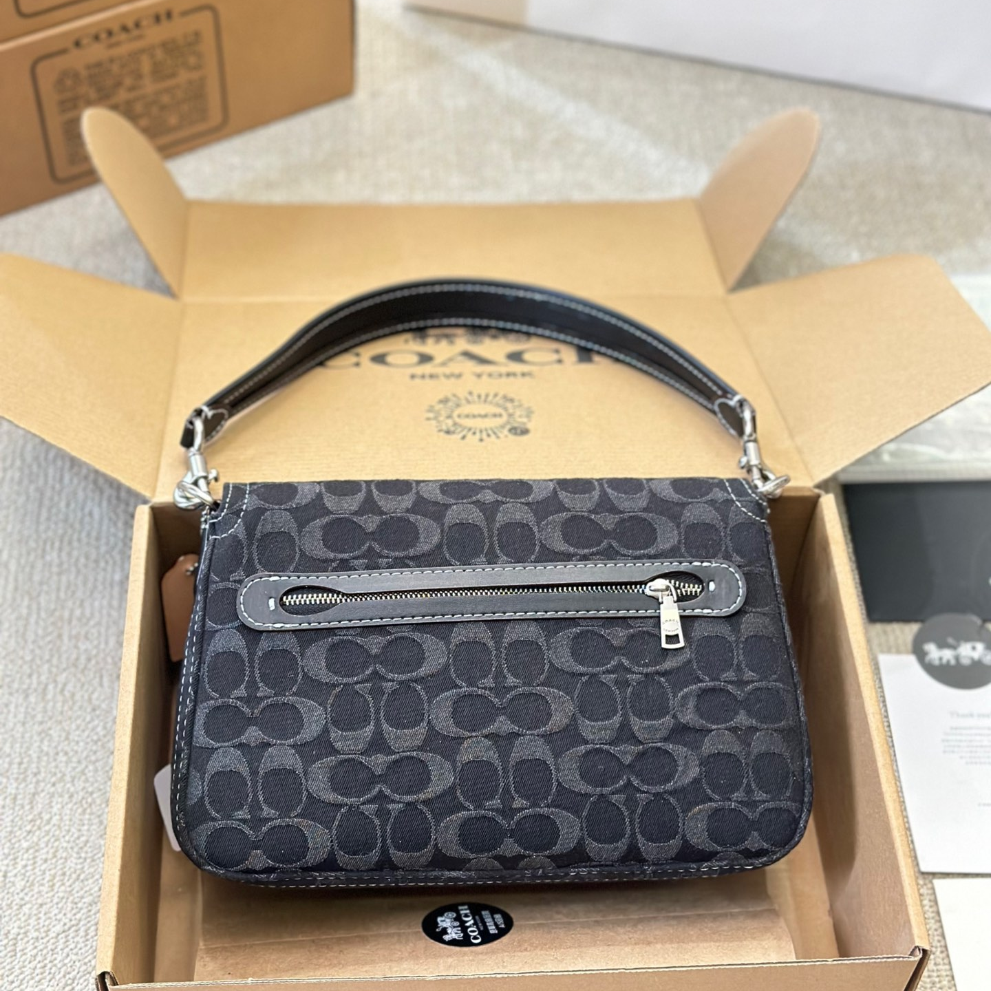 Coach-Embossed denim denim bag