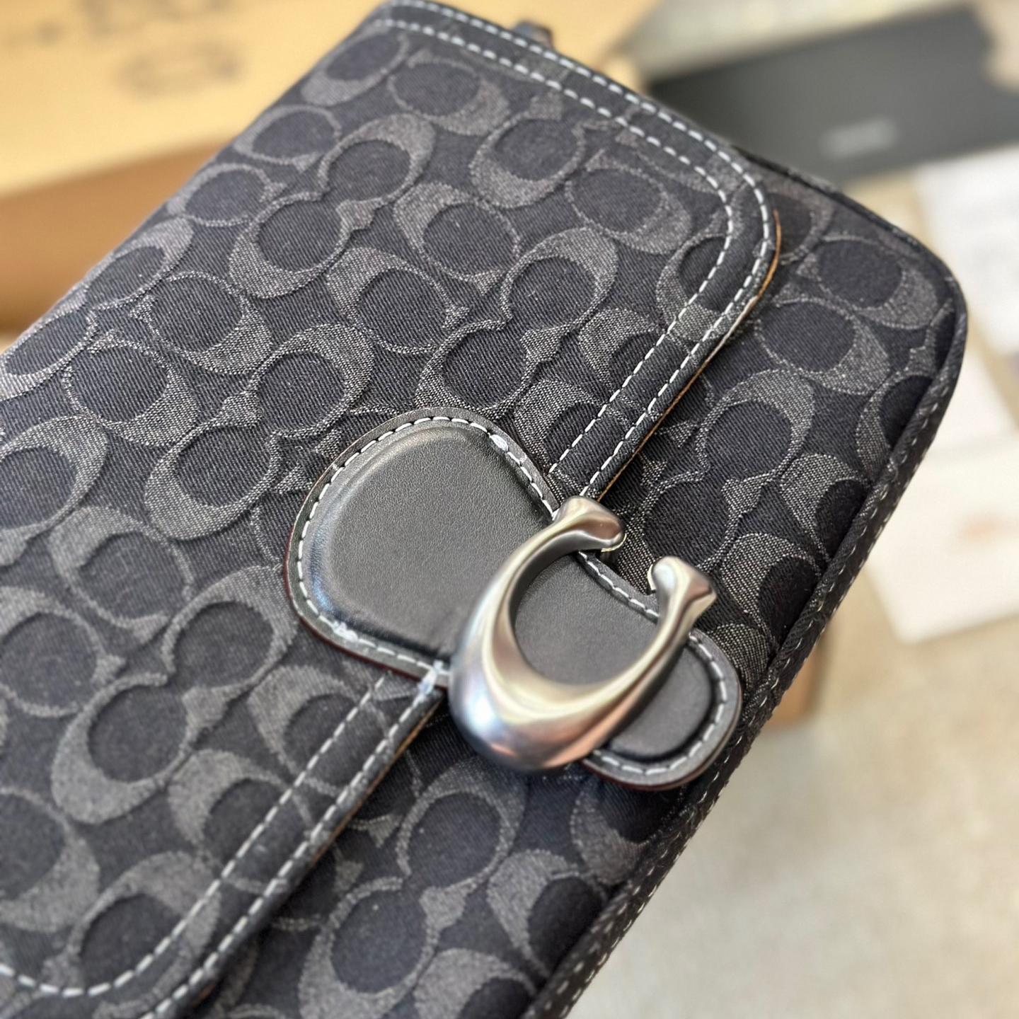 Coach-Embossed denim denim bag