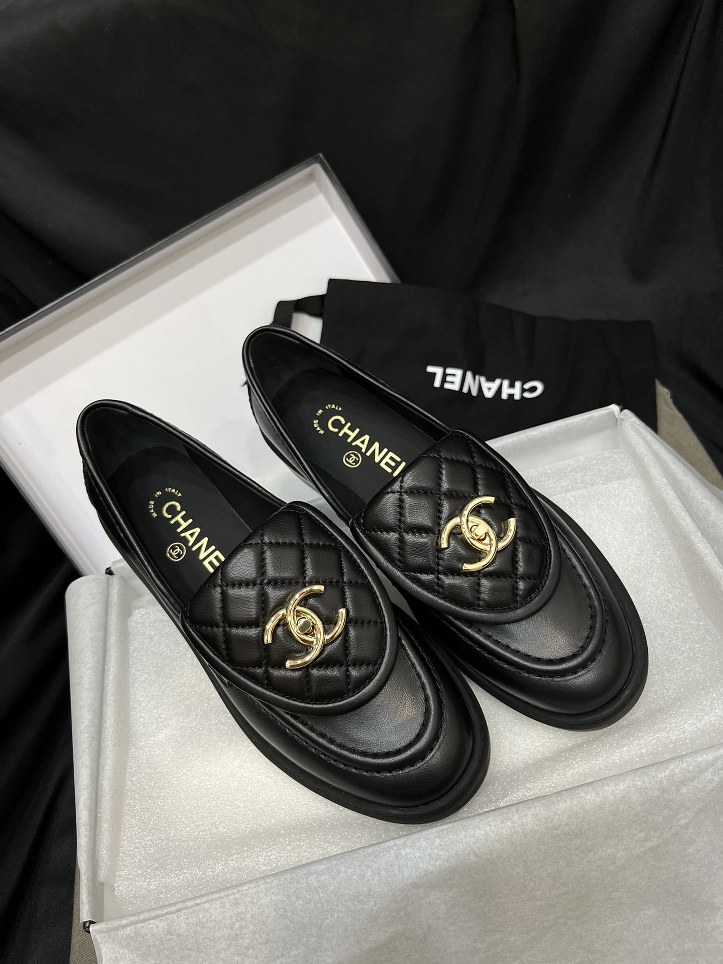 Chanel - Black Quilted Loafers with Gold Logo