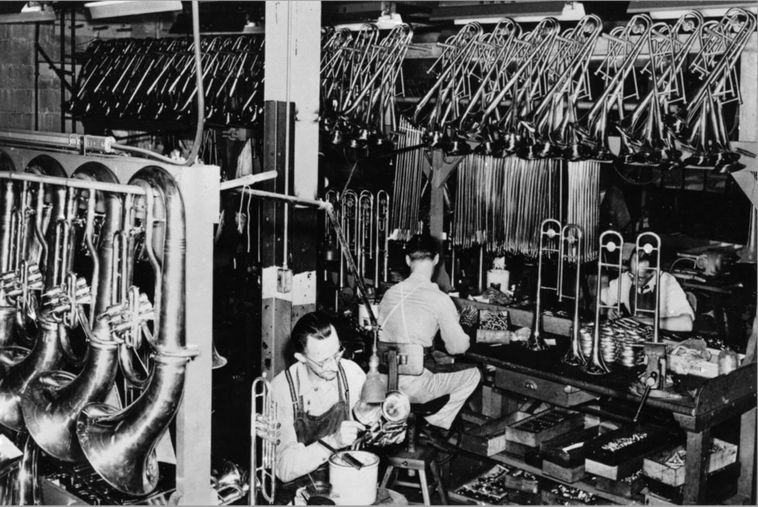 ART.COM Stretched Canvas Print Interior View of a Brass Instrument Factory, Tubas and Trombone by Lantern Press, 36