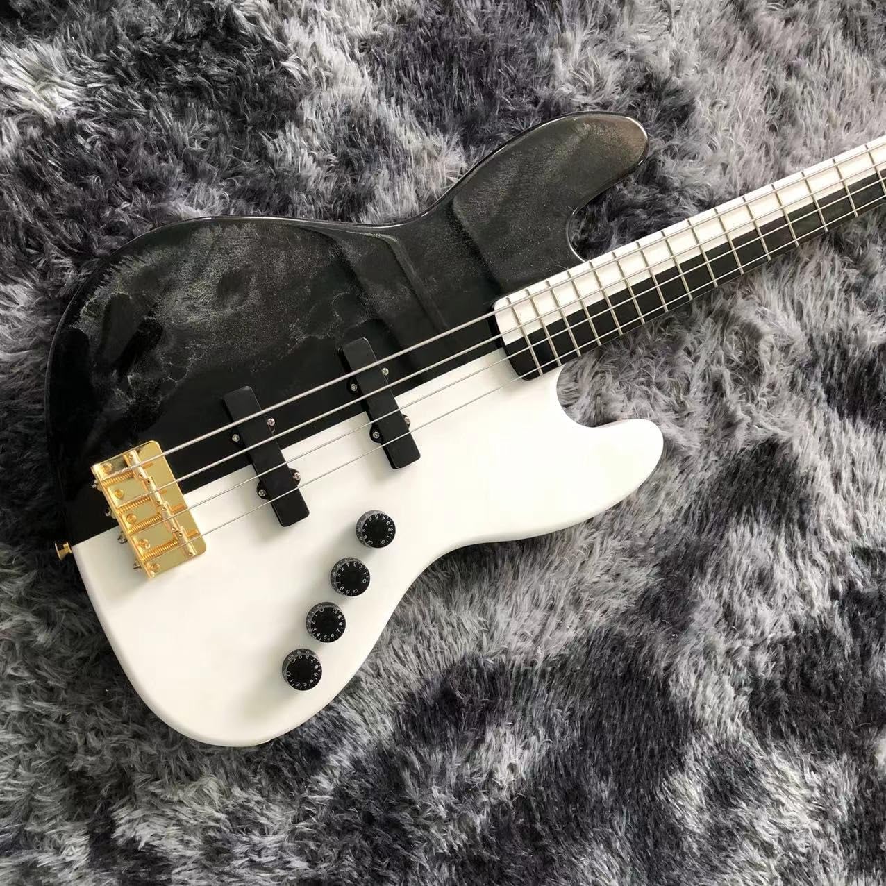 Black and White 4 String Bass with Gold Hardware - Perfect for Professional Bassists and Enthusiasts Seeking High- Sound and Performance