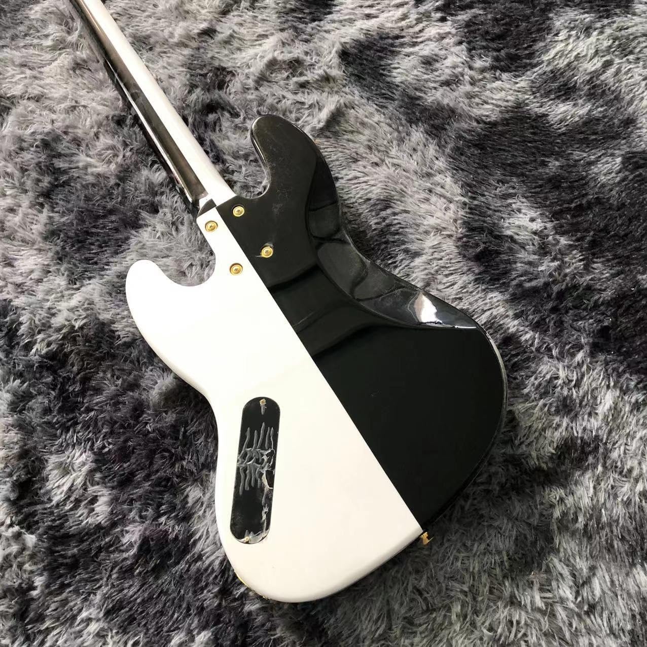 Black and White 4 String Bass with Gold Hardware - Perfect for Professional Bassists and Enthusiasts Seeking High- Sound and Performance