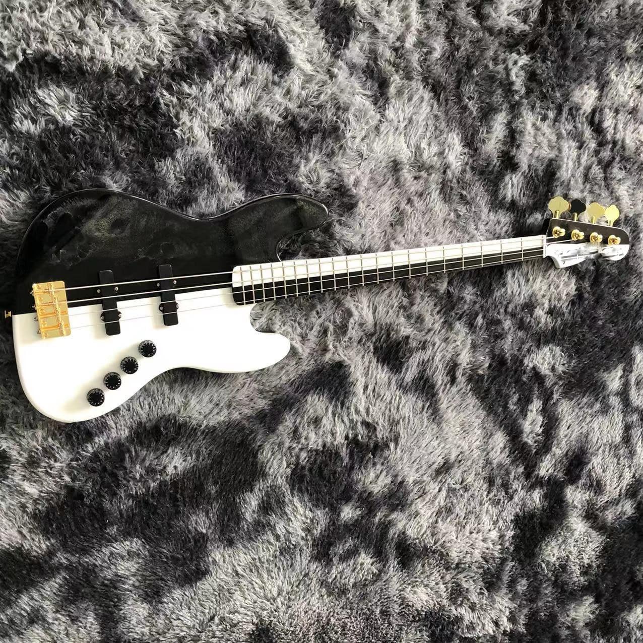 Black and White 4 String Bass with Gold Hardware - Perfect for Professional Bassists and Enthusiasts Seeking High- Sound and Performance