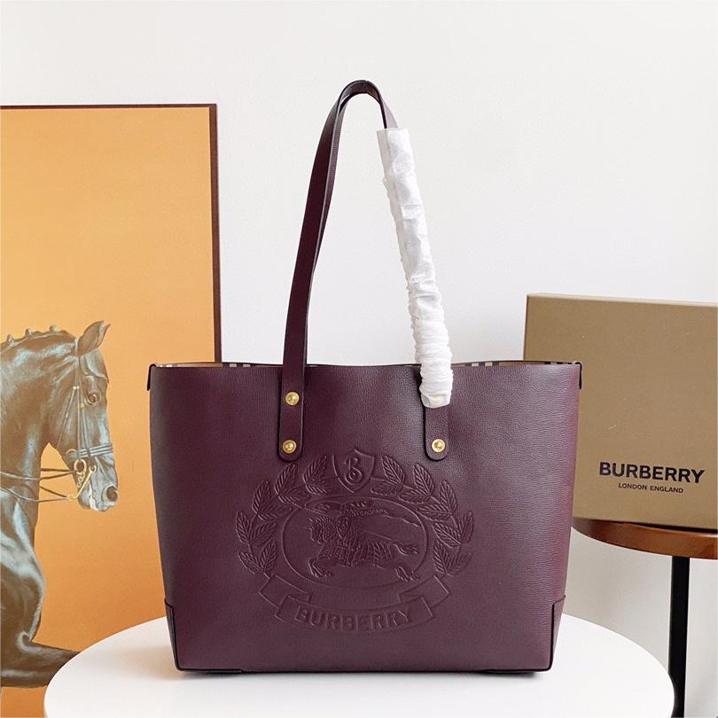 Burberry-Embossed badge leather tote bag