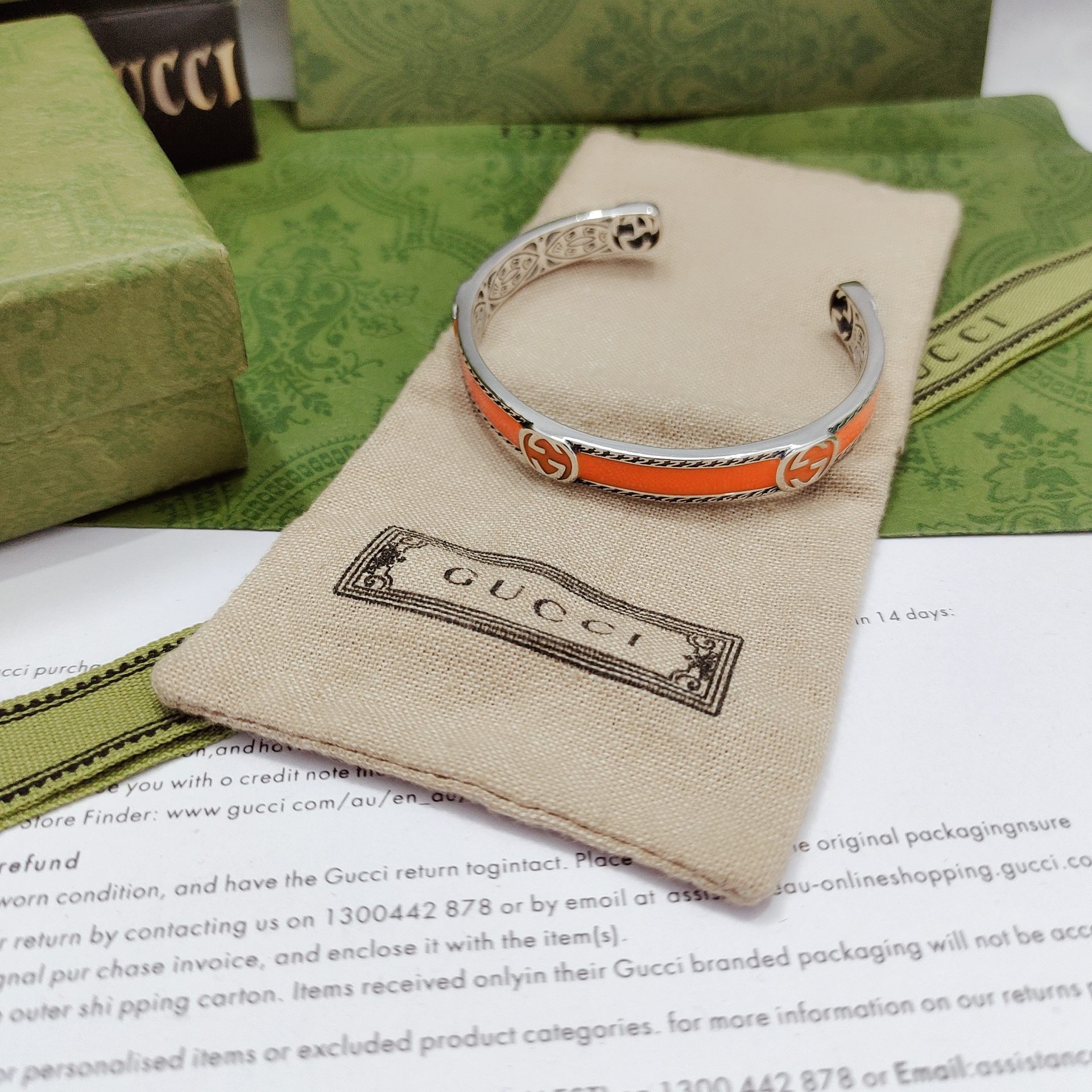 GUCCI-Orange enamel and woven rolled edge bracelet