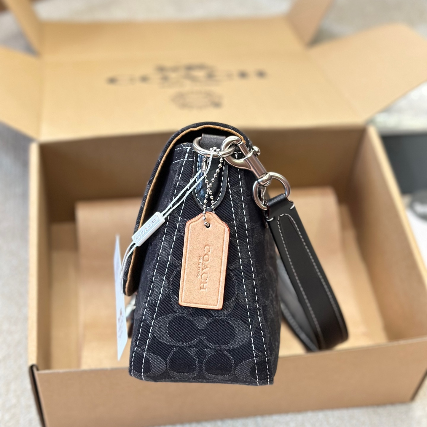 Coach-Embossed denim denim bag