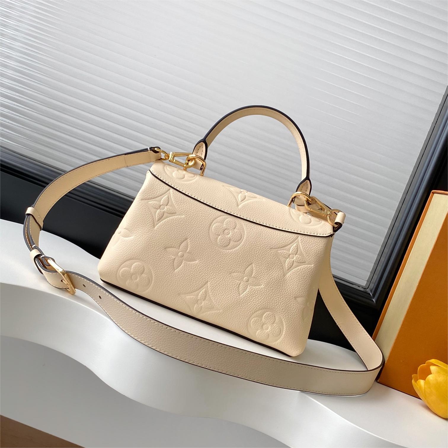 LV-White embossed Madeleine BB handbag