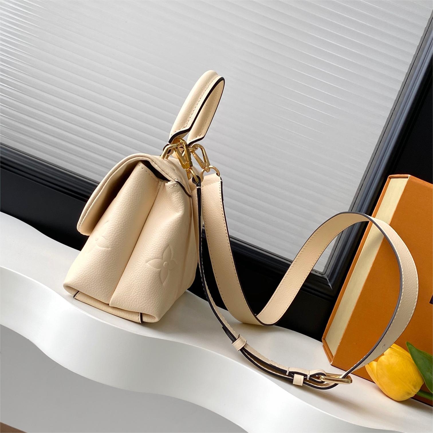 LV-White embossed Madeleine BB handbag