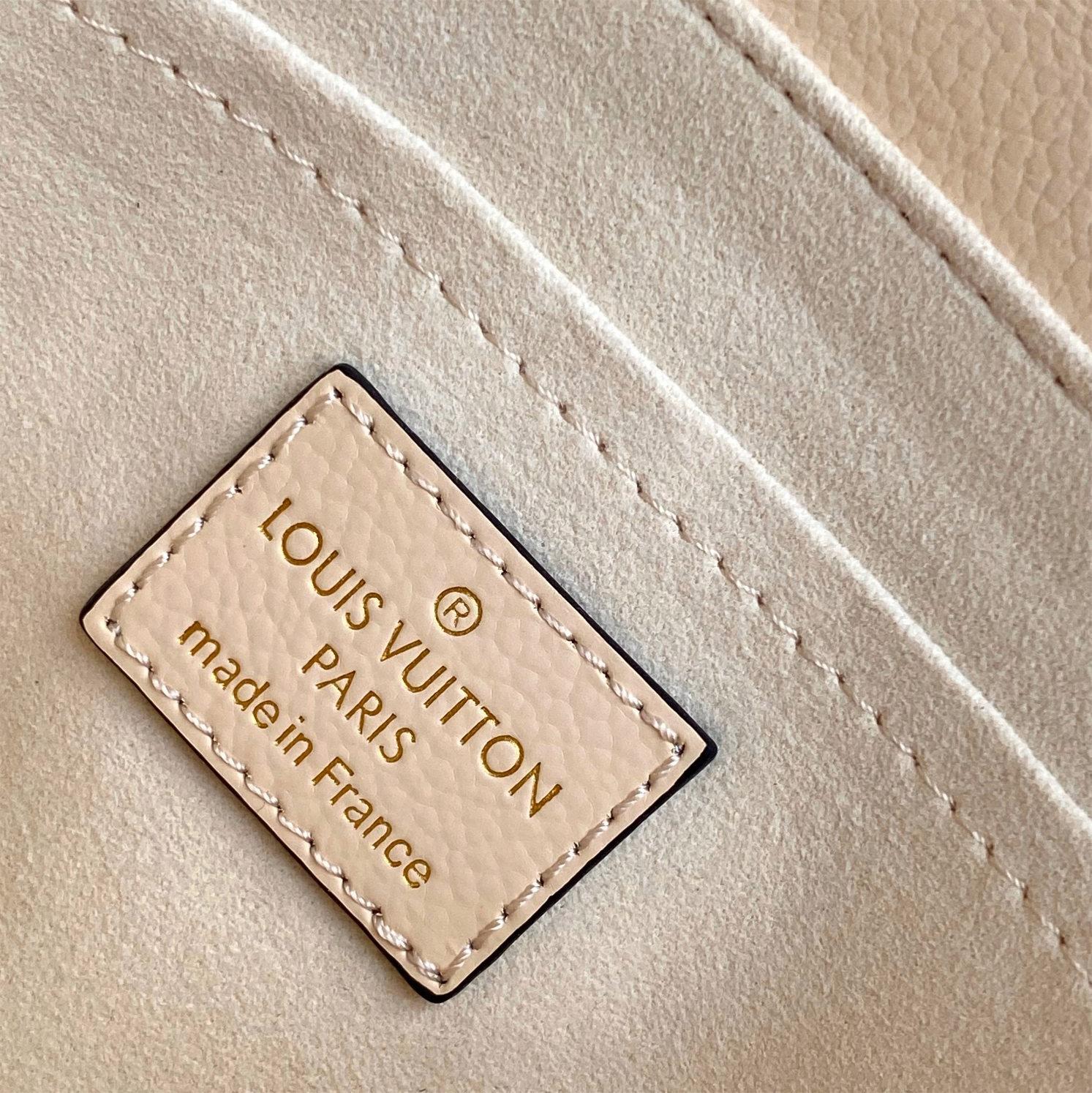 LV-White embossed Madeleine BB handbag