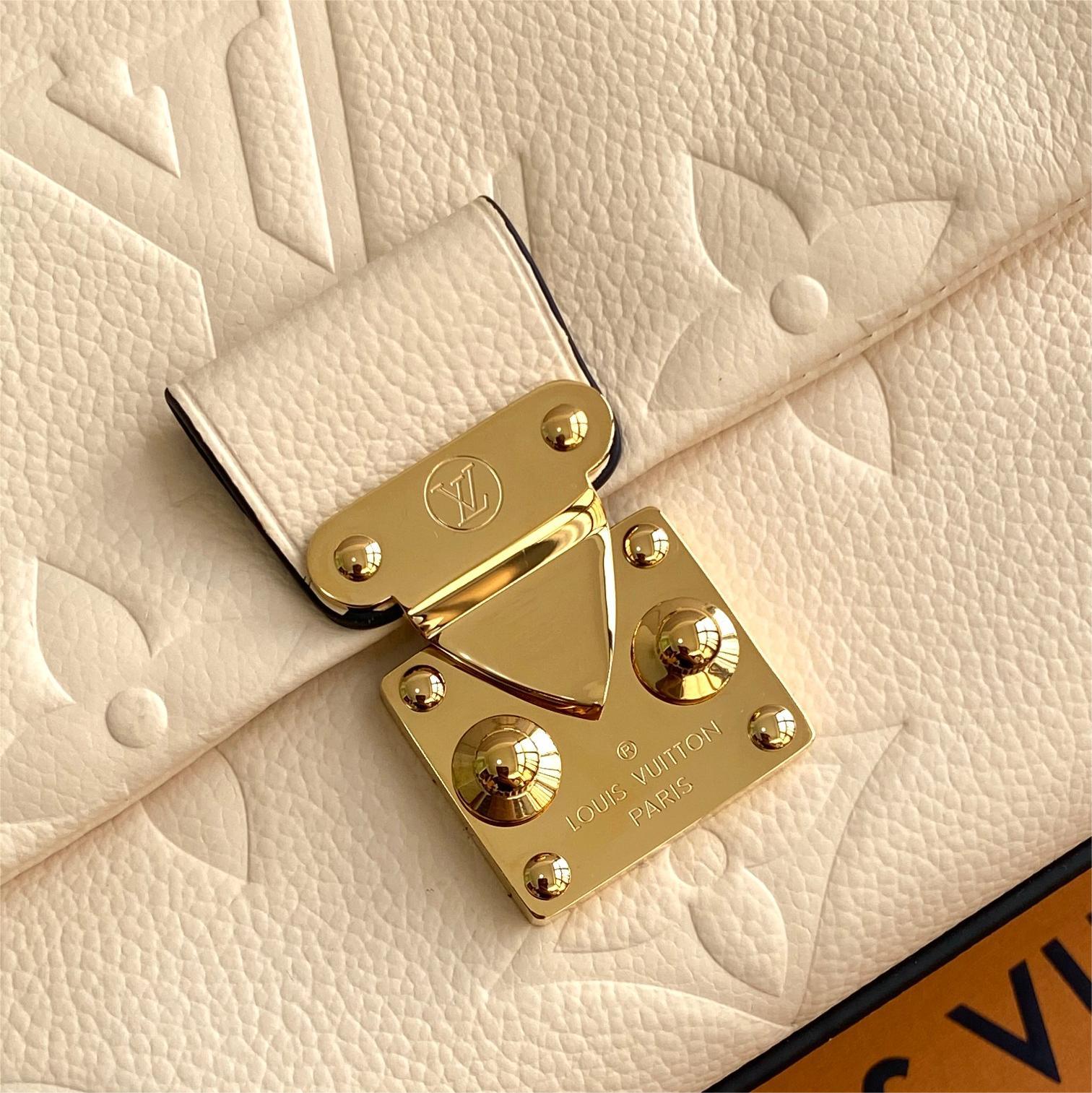 LV-White embossed Madeleine BB handbag