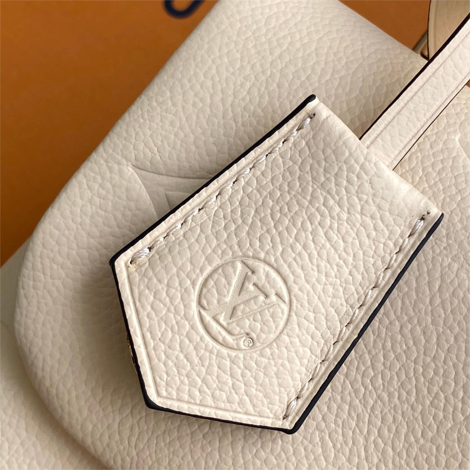LV-White embossed Madeleine BB handbag