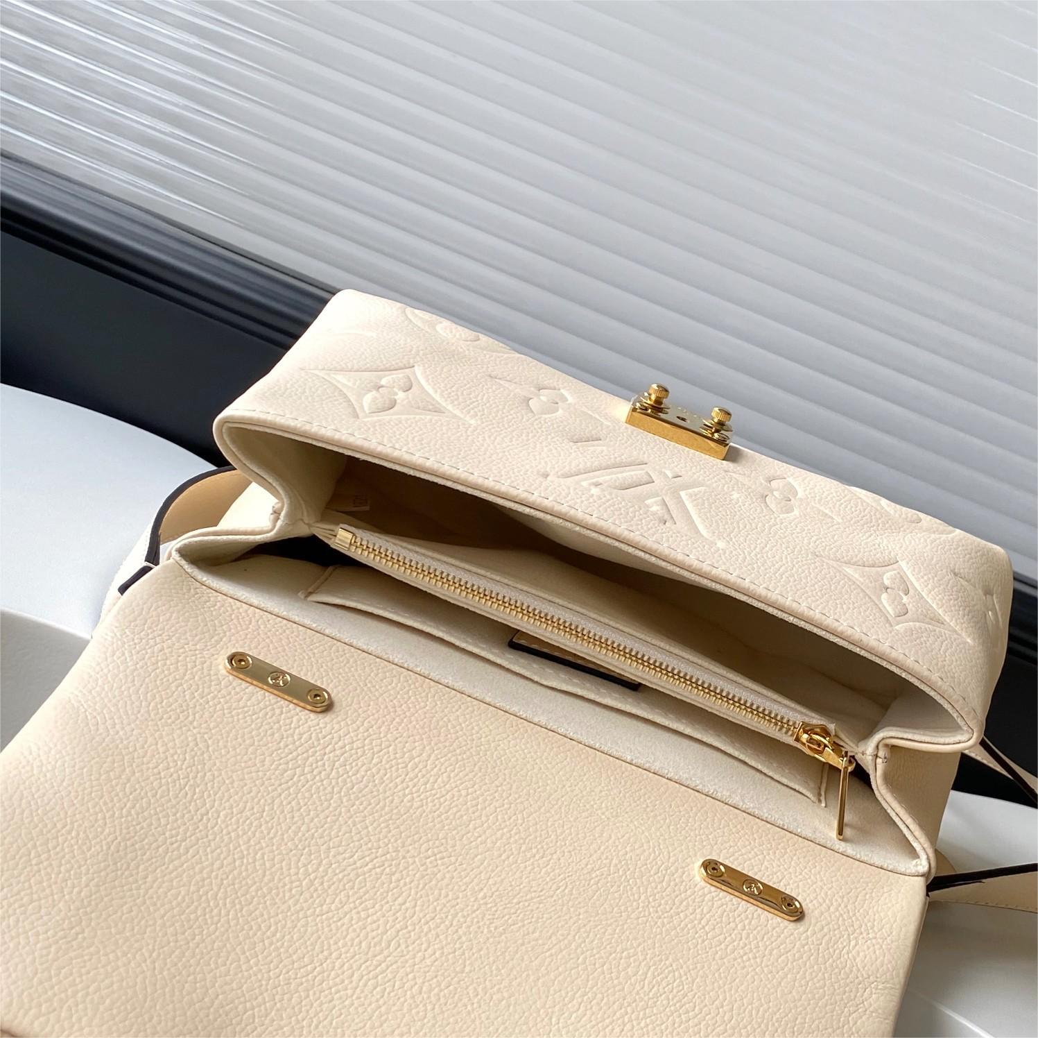 LV-White embossed Madeleine BB handbag